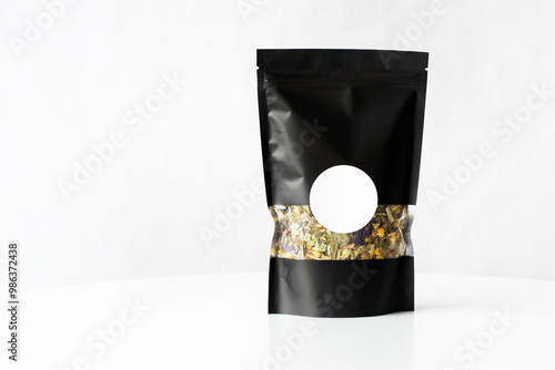 tea Black premium zip package mockup with the tea blend inside isolated on white background with the white label for copy space or label.