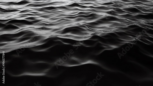 Elegant black and white water texture featuring gentle waves, perfect for backgrounds or artistic projects.