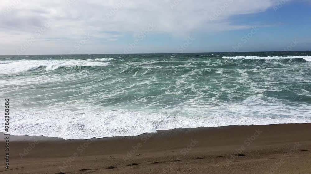 Ocean Waves On Sand Beach With Blue Sky And White Clouds Handheld
Ocean Waves On Sand Beach With Blue Sky And White Clouds Handheld