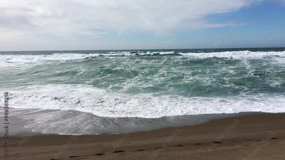 Ocean Waves On Sand Beach With Blue Sky And White Clouds Handheld
Ocean Waves On Sand Beach With Blue Sky And White Clouds Handheld