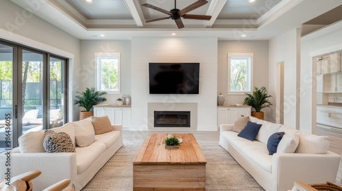 Wallpaper Mural modern living room featuring two white sofas, wooden coffee table, and large flat screen TV. space is bright and airy, with natural light streaming in through large windows, creating welcoming Torontodigital.ca