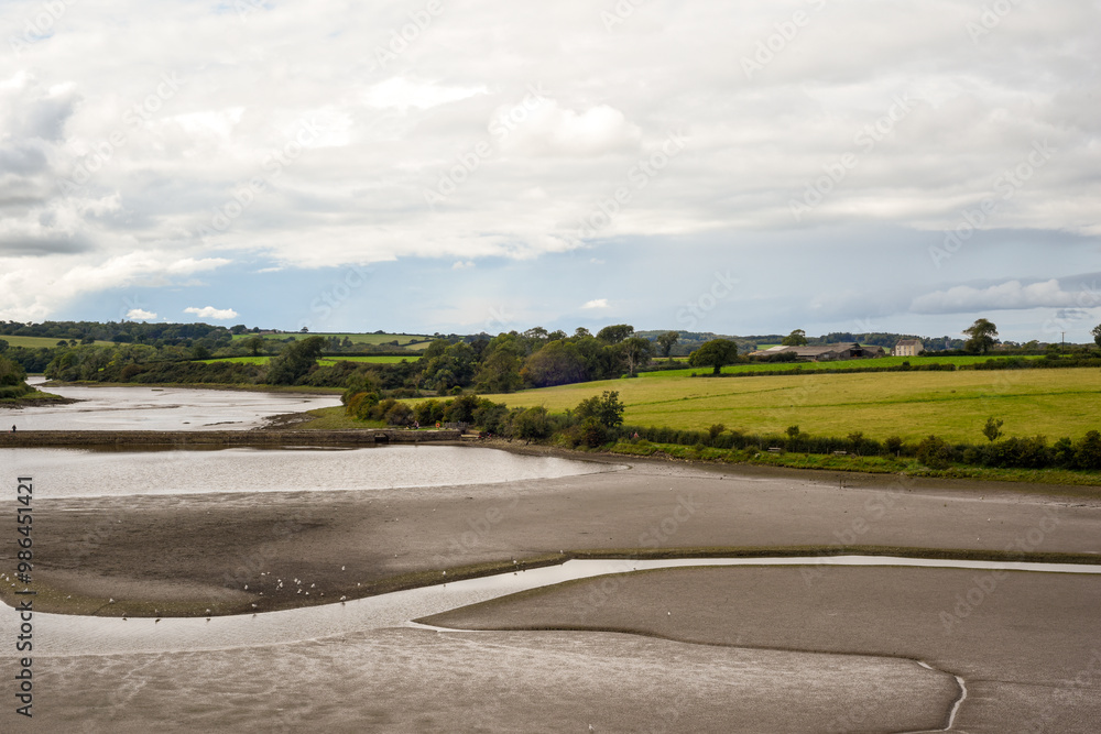 Fototapeta premium Estuary landscape at low tide when the river bed is visible