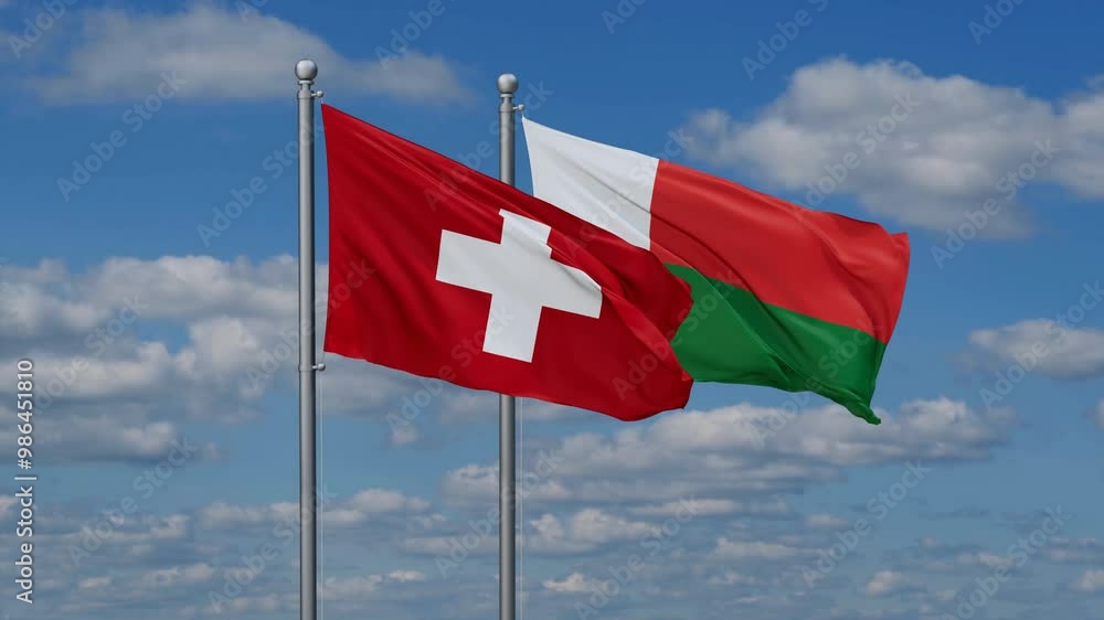 Madagascar and Switzerland flags flying together, video concept of the relationship, two country relations concept Madagascar and Switzerland flags flying together, video concept of the relationship, two country relations concept