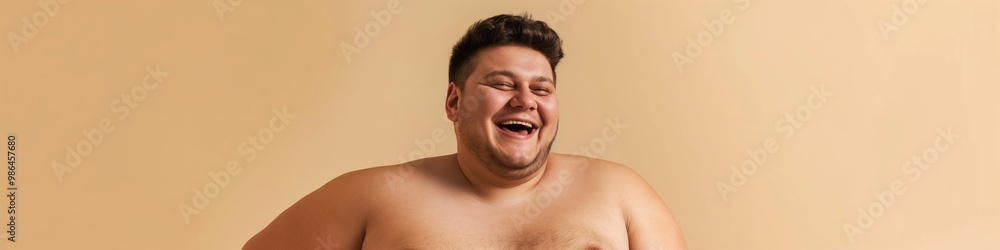 Naklejka premium A man with a big belly laughs. The man is wearing no shirt