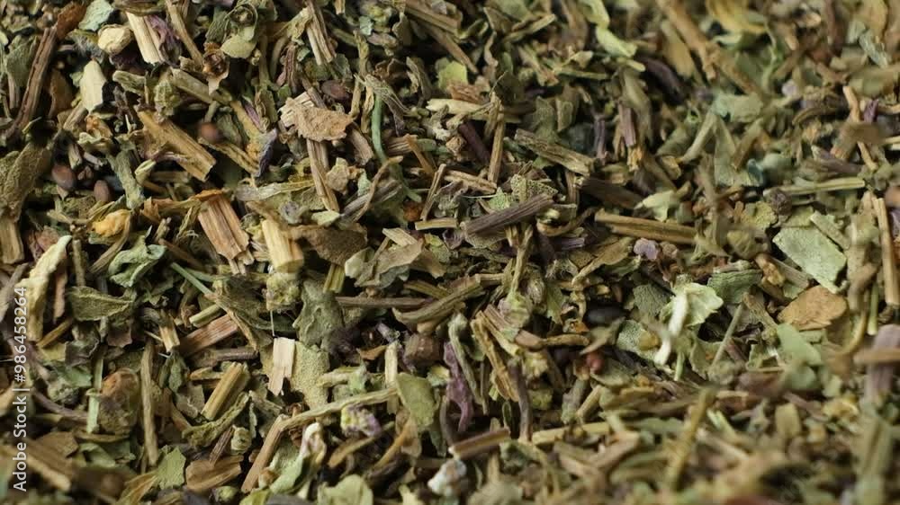 Macro slow motion pouring dried basil seasoning. Macro slow motion pouring dried basil seasoning.