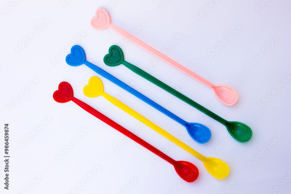 A photo of a colorful teaspoon. This spoon is used to take sugar and then stir the sugar in the hot tea. A photo of a colorful teaspoon. This spoon is used to take sugar and then stir the sugar in the hot tea.