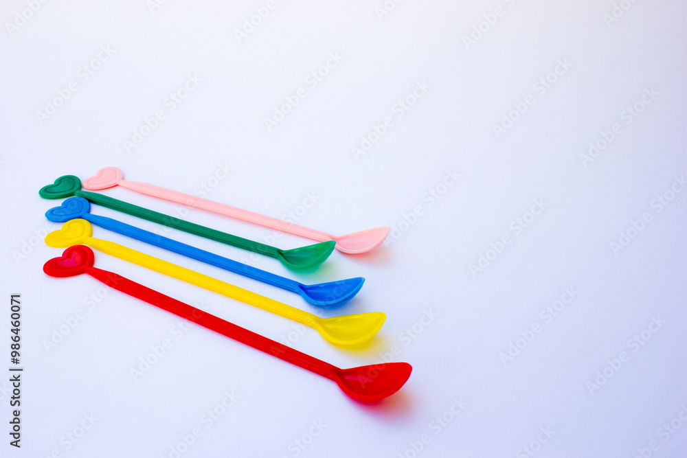A photo of a colorful teaspoon. This spoon is used to take sugar and then stir the sugar in the hot tea. A photo of a colorful teaspoon. This spoon is used to take sugar and then stir the sugar in the hot tea.