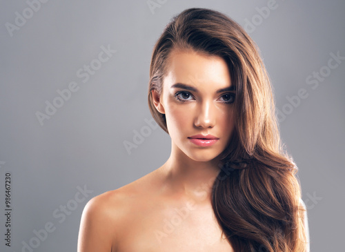 Mockup, hairstyle and portrait of woman in studio for glow, beauty and hair gloss treatment. Scalp health, salon and growth with person on gray background for haircare cosmetics, volume and keratin