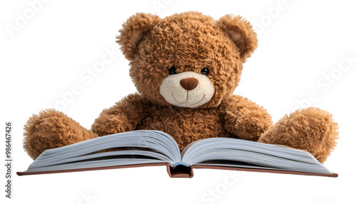 a teddy bear sitting on an open book. 