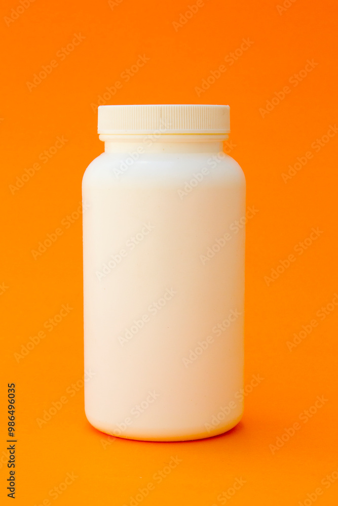 A white plastic bottle. This bottle is commonly used to store vitamins or medicines such as capsules or pills. A white plastic bottle. This bottle is commonly used to store vitamins or medicines such as capsules or pills.