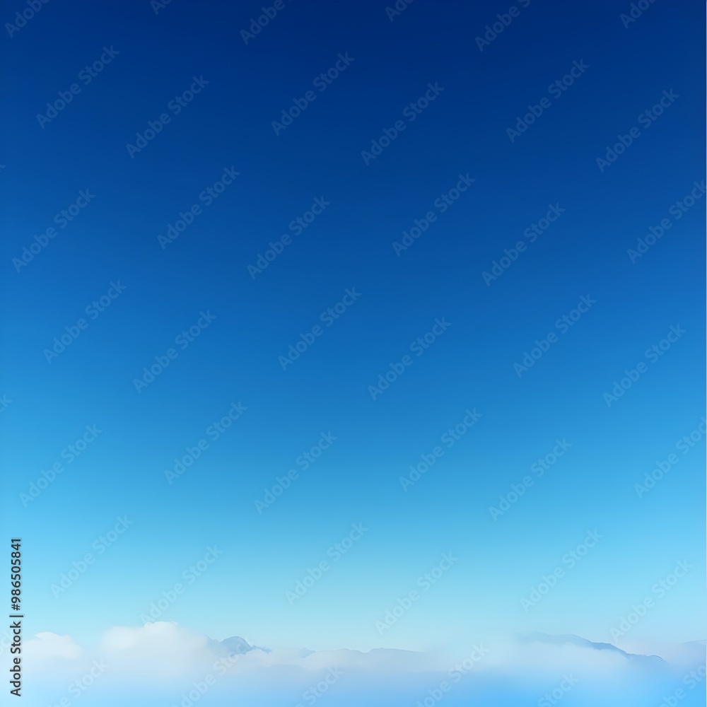 Fototapeta premium A stunning view of a clear blue sky with wispy clouds at the horizon.