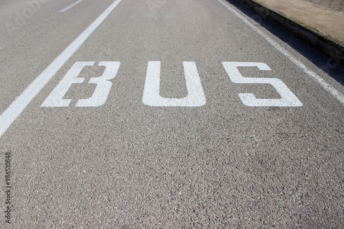 bus lane with some letters that say bus