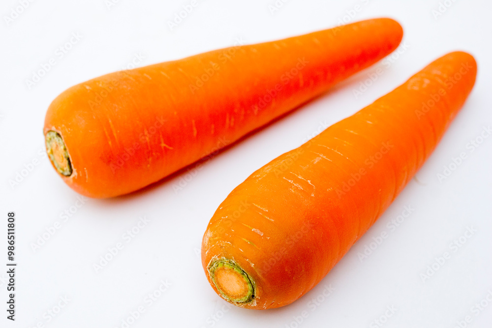The carrot, scientifically known as Daucus carota subsp. sativus, is a root vegetable that belongs to the family Apiaceae. The plant can grow up to 30-60 cm tall, with feather-like green leaves. The t The carrot, scientifically known as Daucus carota subsp. sativus, is a root vegetable that belongs to the family Apiaceae. The plant can grow up to 30-60 cm tall, with feather-like green leaves. The t