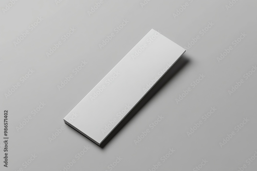 Blank White Rectangle Lying on a Gray Surface Blank White Rectangle Lying on a Gray Surface