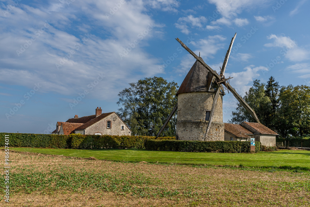 View of an old windmill in the Seine-et-Marne region of France View of an old windmill in the Seine-et-Marne region of France