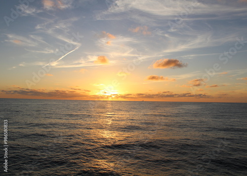 Sunset over the horizon in the North Sea  photo