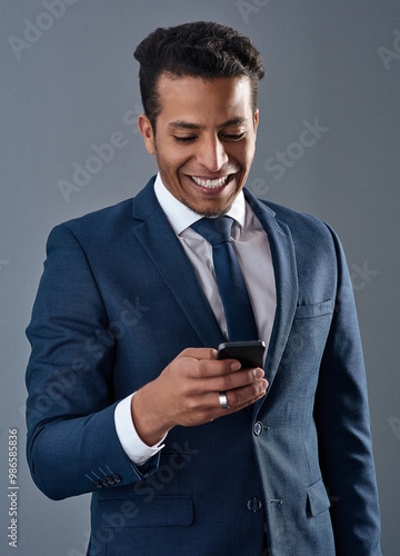 Phone, business and smile with man in studio for investment consultant, commercial broker and negotiation closer. Communication, contact and networking with account agent on gray background for deal