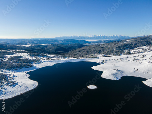 Winter view of Rila mountain near Belmeken Dam, Bulgaria photo