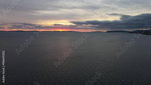 Wallpaper Mural Drone footage of a peaceful sunset over the Adriatic Sea near Split, Croatia, showcasing the serene beauty of the ocean, distant islands, and the colorful sky. Torontodigital.ca