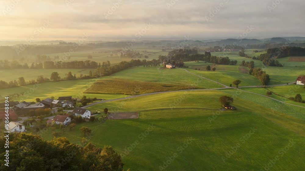 Aerial drone view of morning fog over the green Allgäu hills in Bavaria Aerial drone view of morning fog over the green Allgäu hills in Bavaria
