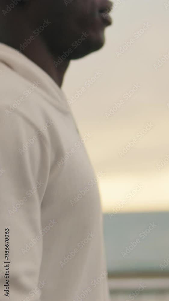 Close-up of athlete's male legs during jogging along the seaside promenade, cardio workout Close-up of athlete's male legs during jogging along the seaside promenade, cardio workout