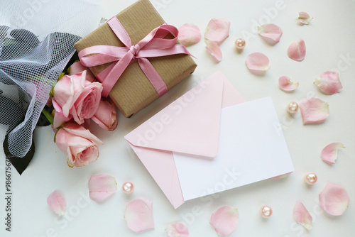 greeting card. rose bouquet and gift box with bow	