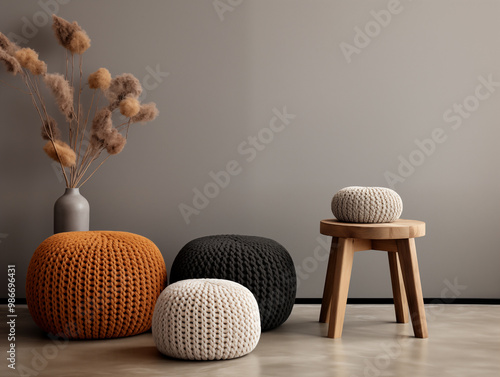 Modern interior design of scandinavian living room with chunky knit textured pouffs in autumn and neutral colors photo