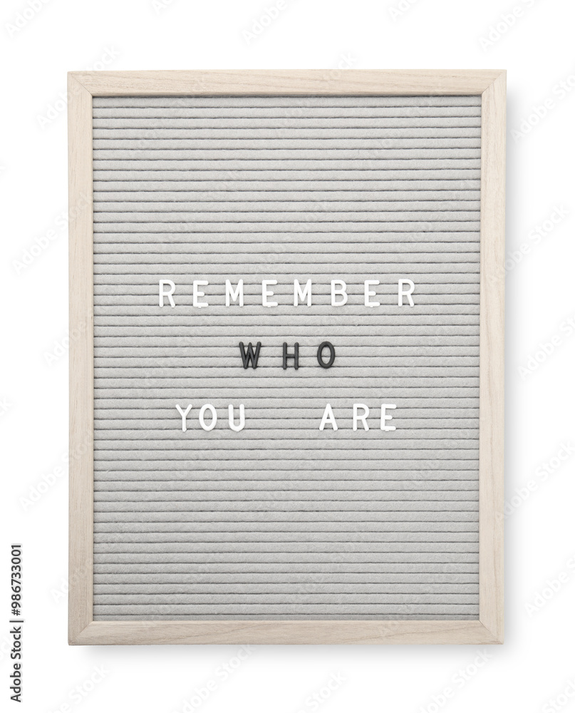 Letter board with phrase Remember who you are on white background, top view Letter board with phrase Remember who you are on white background, top view