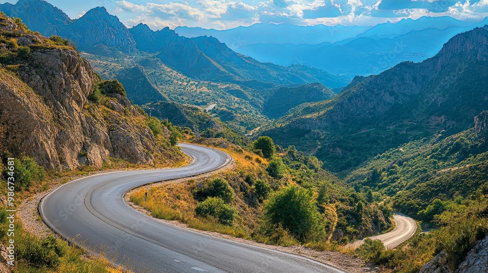 Winding Asphalt Road Through Mountainous Landscape Winding Asphalt Road Through Mountainous Landscape