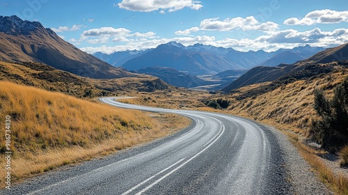 Winding Asphalt Road Through a Mountain Valley in New Zealand