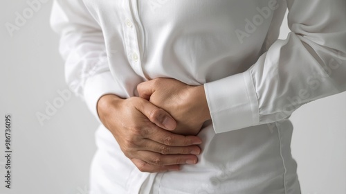 Abdominal pain of a young woman. Taken from the front view on a white background. Abdominal pain Menstrual pain of women