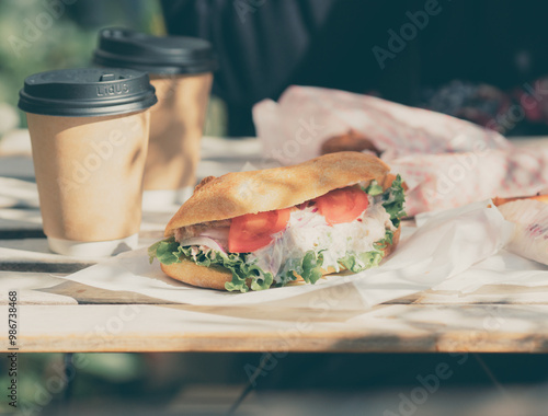 Fresh Sandwich and Coffee To-Go on Rustic Wooden Table