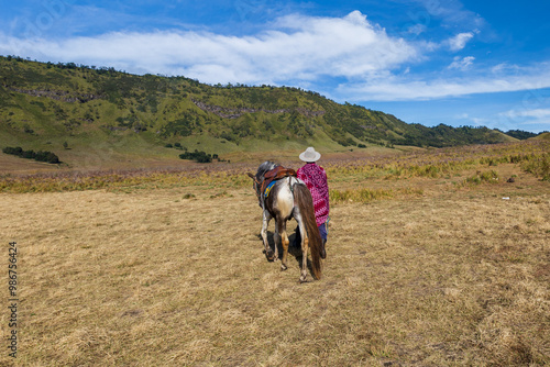 A man of Tengger tribe works as tourist guide around Bromo Mountain.  photo