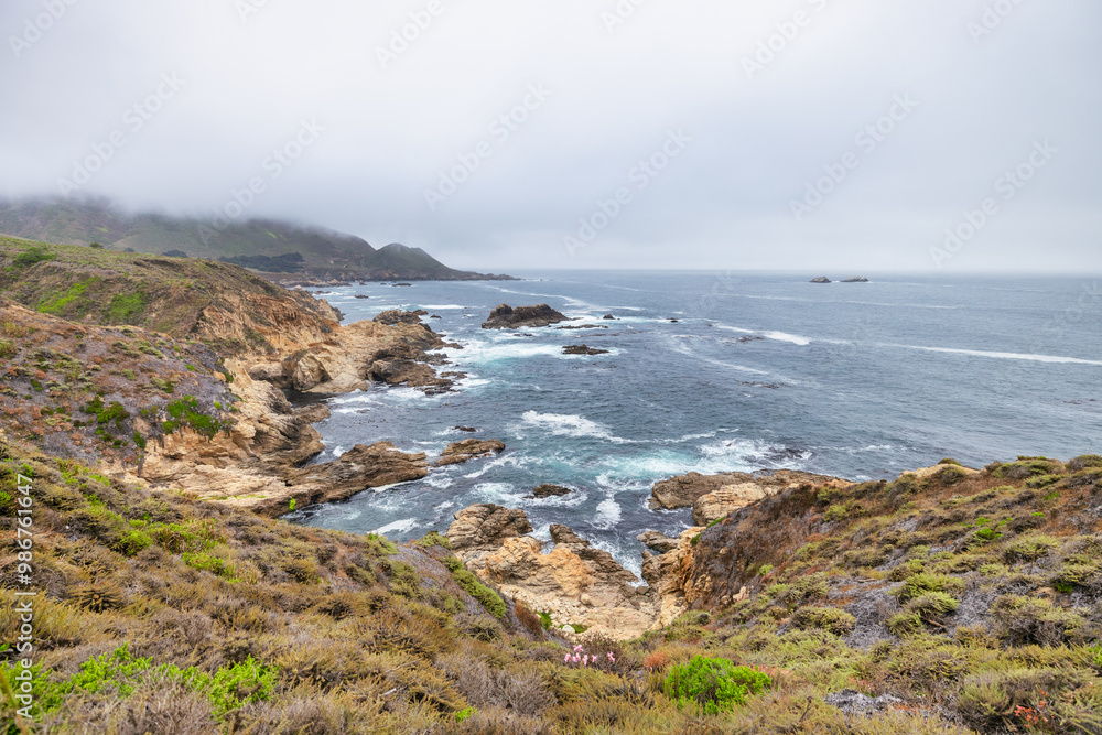 Beautiful landscape of Pacific Ocean coast along Highway 1 and Big Sur, aerial view, sunset, sunrise, fog. Concept, travel, vacation, weekend Beautiful landscape of Pacific Ocean coast along Highway 1 and Big Sur, aerial view, sunset, sunrise, fog. Concept, travel, vacation, weekend