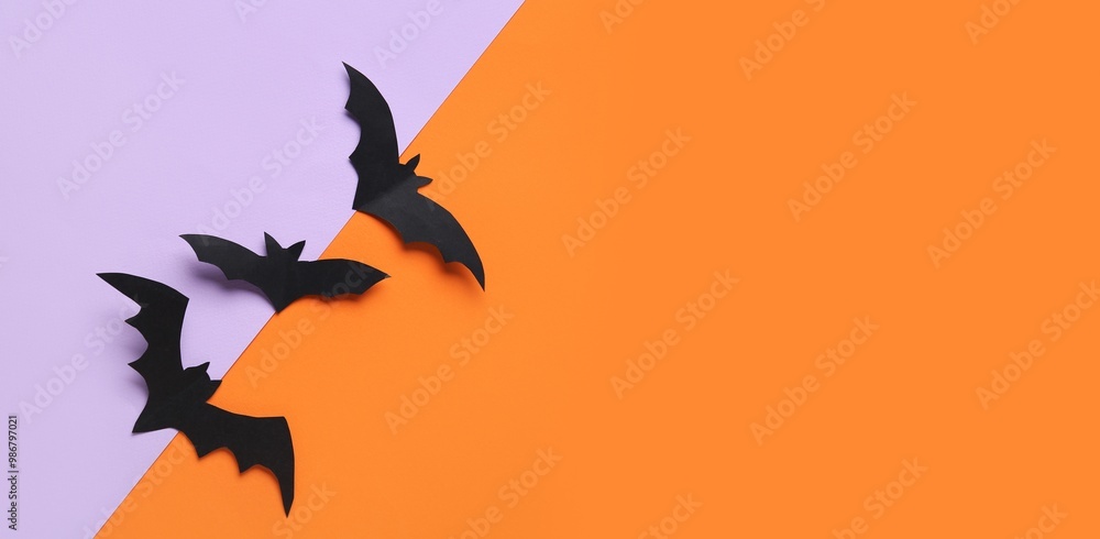 Fototapeta premium Paper bats for Halloween party on colorful background with space for text