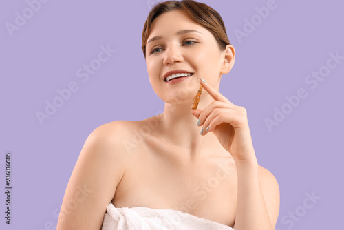 Wallpaper Mural Young woman with ampoule on lilac background, closeup Torontodigital.ca