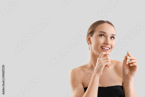 Thoughtful young woman with...
