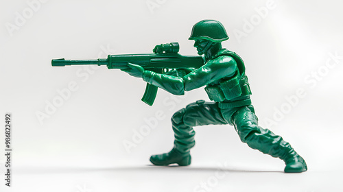 Full body of green toy soldier aiming with a rifle on white background 