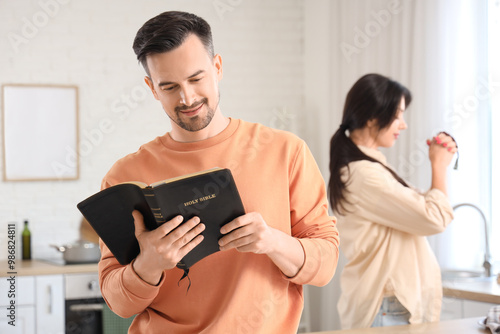 Religious young man reading...