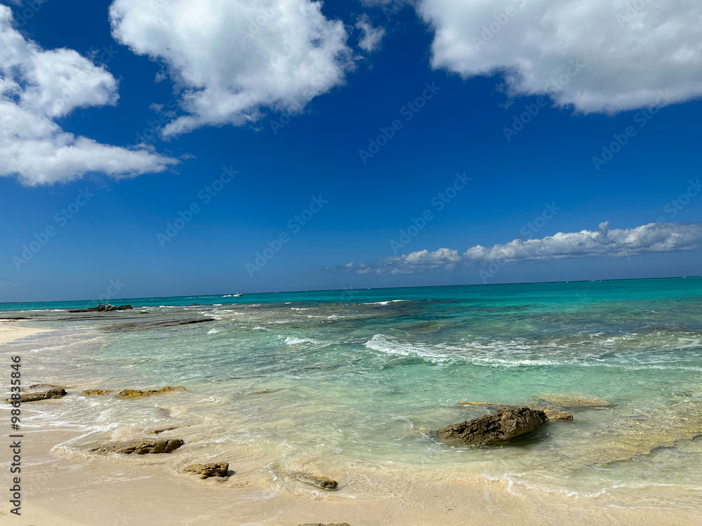 Turquoise waters with rocks and blue sky Turquoise waters with rocks and blue sky
