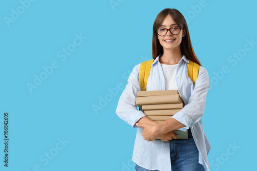 Happy female student with b...