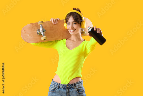 Young girl with spray can a...