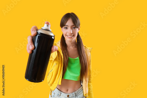 Young girl with spray can o...