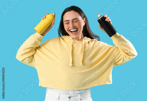 Happy young woman with spra...