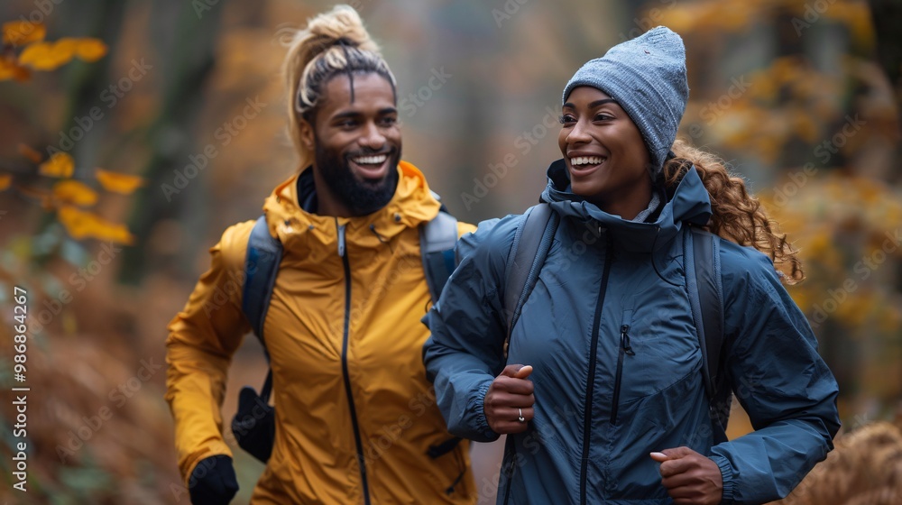 Joyful athletic couple enjoying a stroll in the outdoors. Blank area for text. Joyful athletic couple enjoying a stroll in the outdoors. Blank area for text.