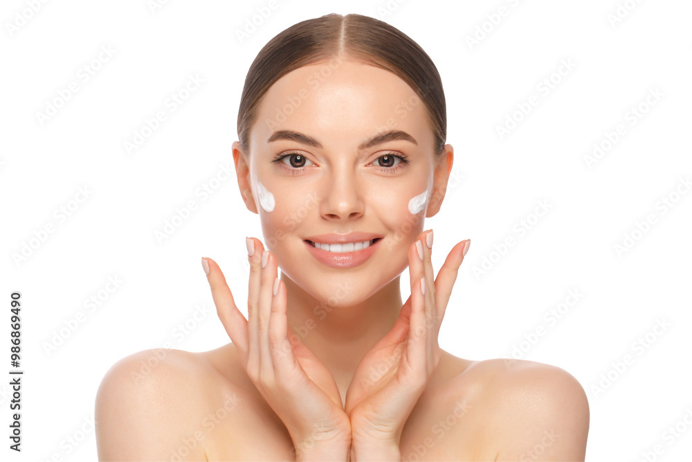 Young beautiful woman with clear skin applying face cream with fingers Young beautiful woman with clear skin applying face cream with fingers