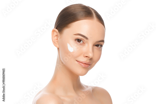 Fotografi Portrait of young beautiful brown-eyed girl with face cream on cheekbones and gl