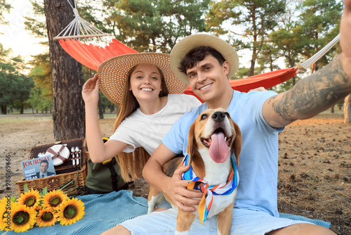Young couple with Beagle do...