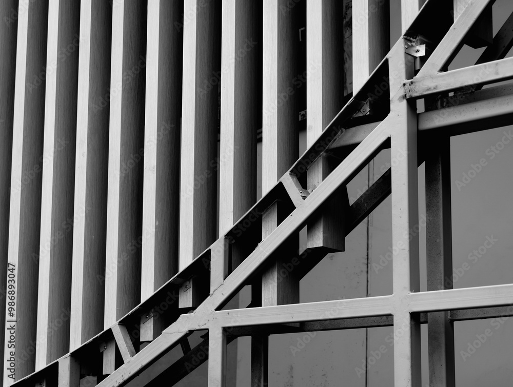 Fototapeta premium A structure featuring wooden slats on construction site contributing to its architectural style