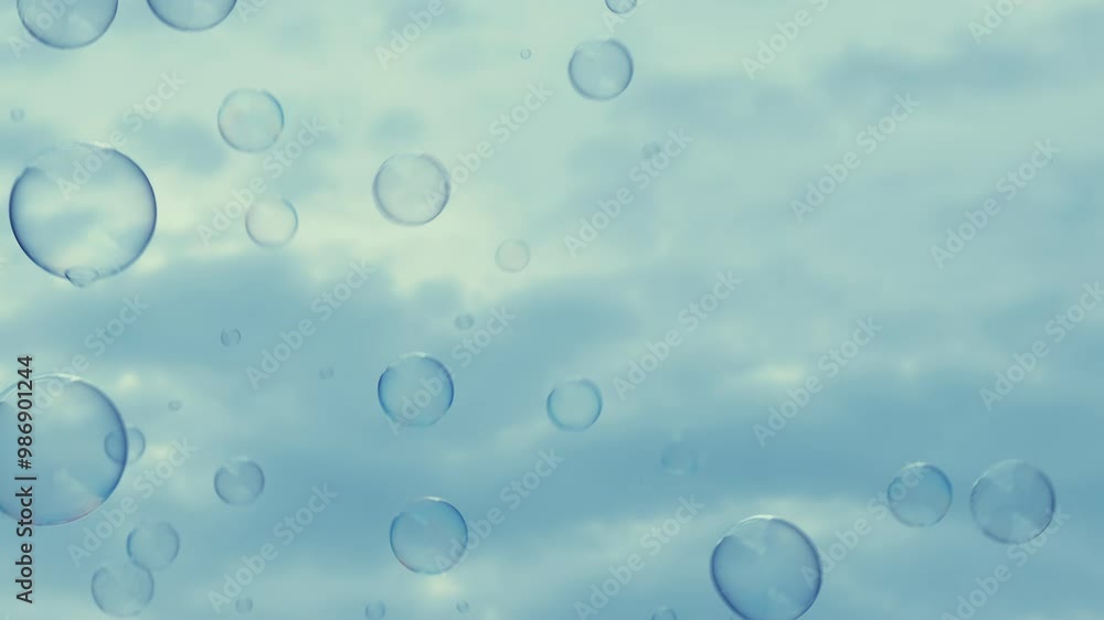Lots of transparent bubbles flying in a cloudy sky. Lots of transparent bubbles flying in a cloudy sky.